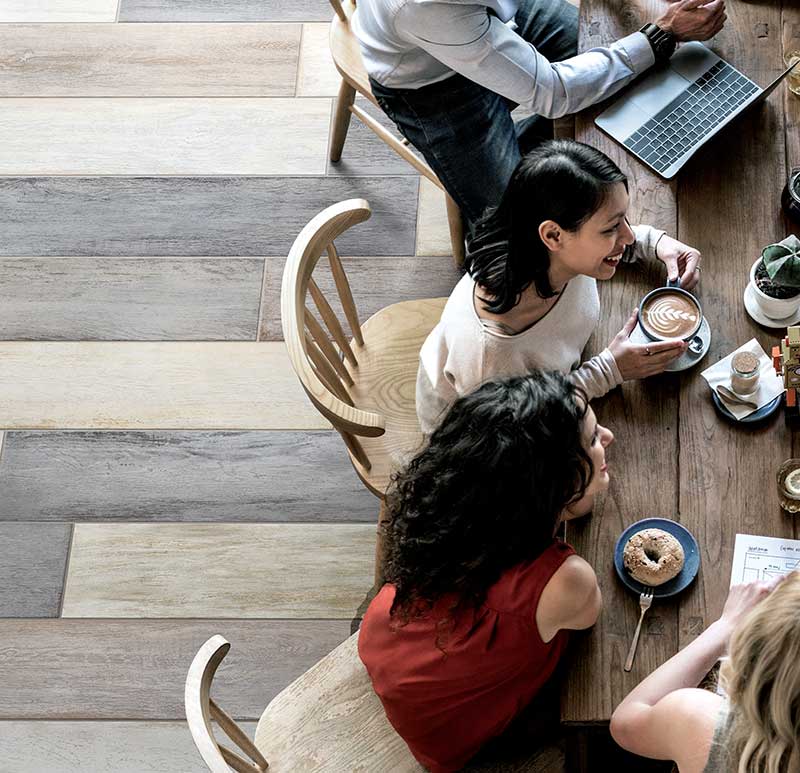 People at table from above showing floor tile